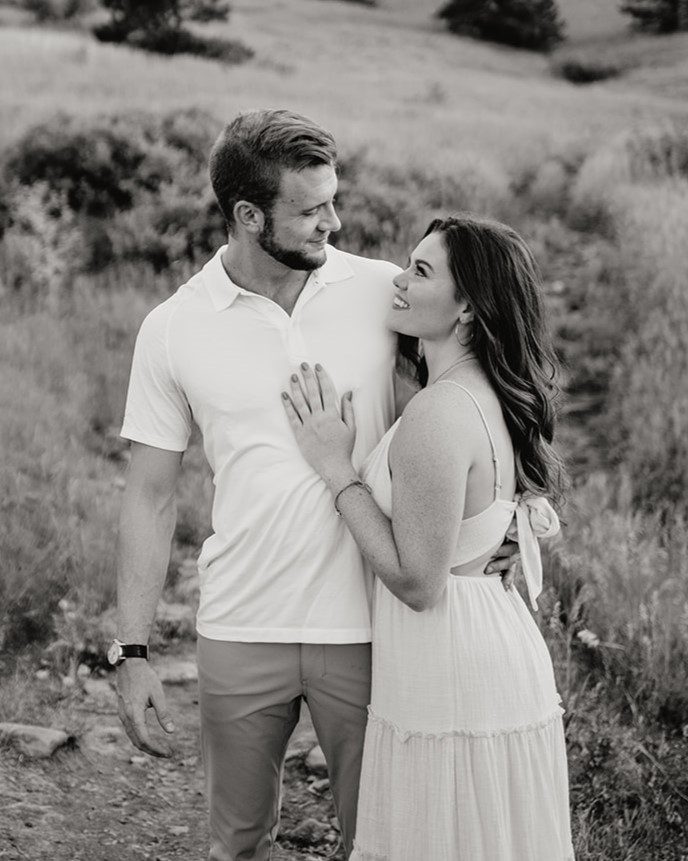 girlfriend smiling up at her boyfriend during their couples photoshoot at chautauqua park