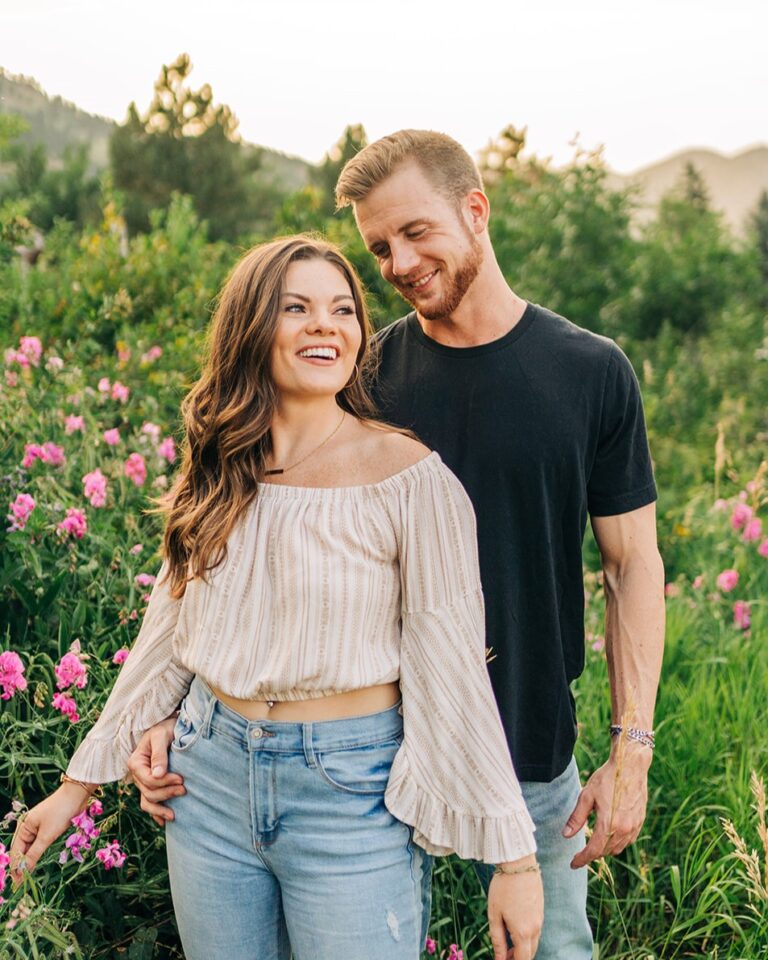 boyfriend looking down at his girlfriend smiling during their boulder colorado couples session at chautauqua park