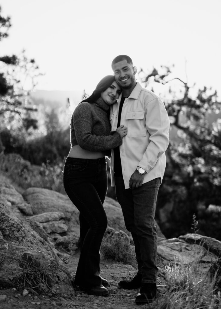 A black and white photo of a couple during their engagement photos at Lost Gulch Overlook, Colorado