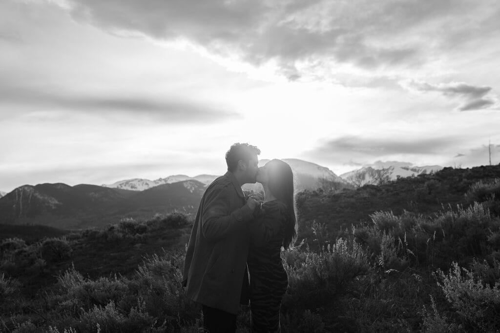 Couple kissing at Sapphire Point Overlook at sunset
