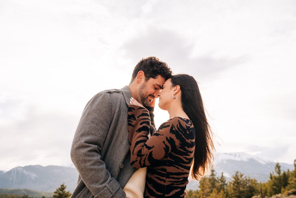 Couple nose to nose during their engagement session at Sapphire Point Overlook in Breckenridge, CO
