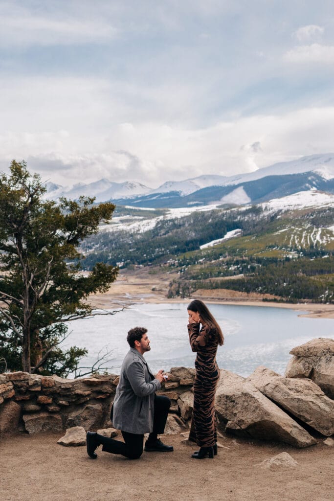 Man proposing with mountain view
