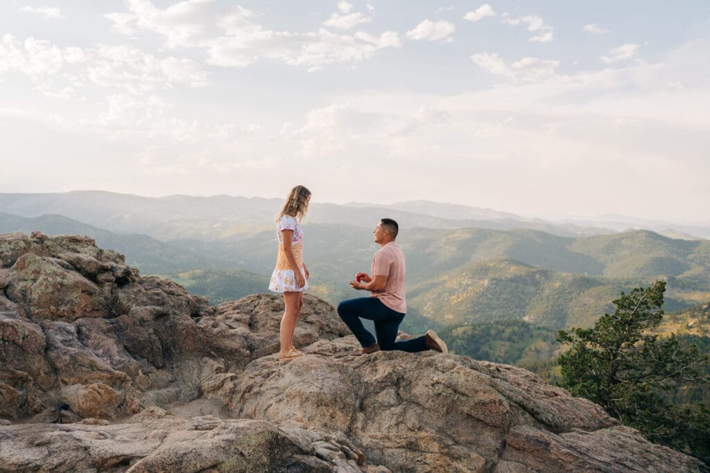 Boyfriend proposing to his girlfriend at Lost Gulch Overlook in Boulder, Colorado