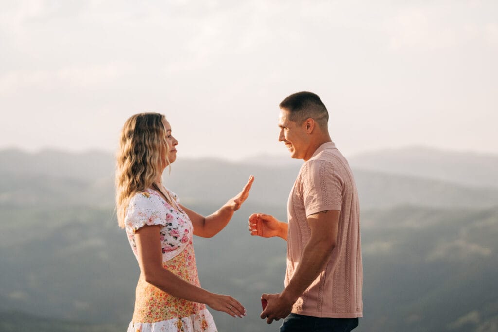 Couple enjoying a scenic mountain view together.