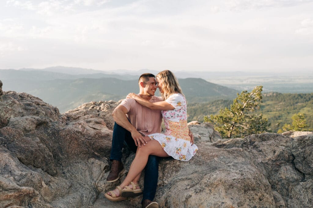 Couple hugging after their proposal at Lost Gulch Overlook in Boulder, Colorado