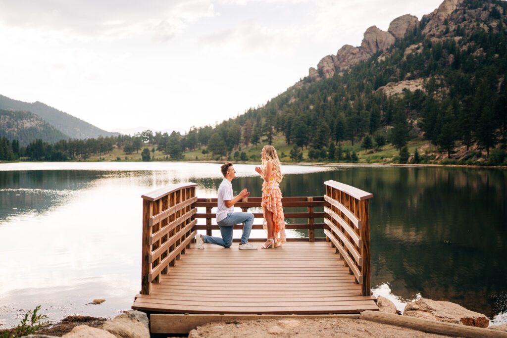 boyfriend down on his knee proposing to his girlfriend during their Lily Lake Engagement Photos