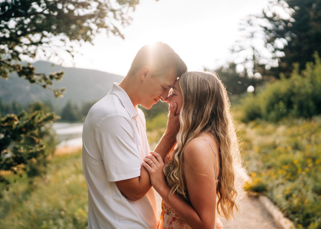 boyfriend and girlfriend forehead to forehead with their eyes closed during their lily lake engagement photos