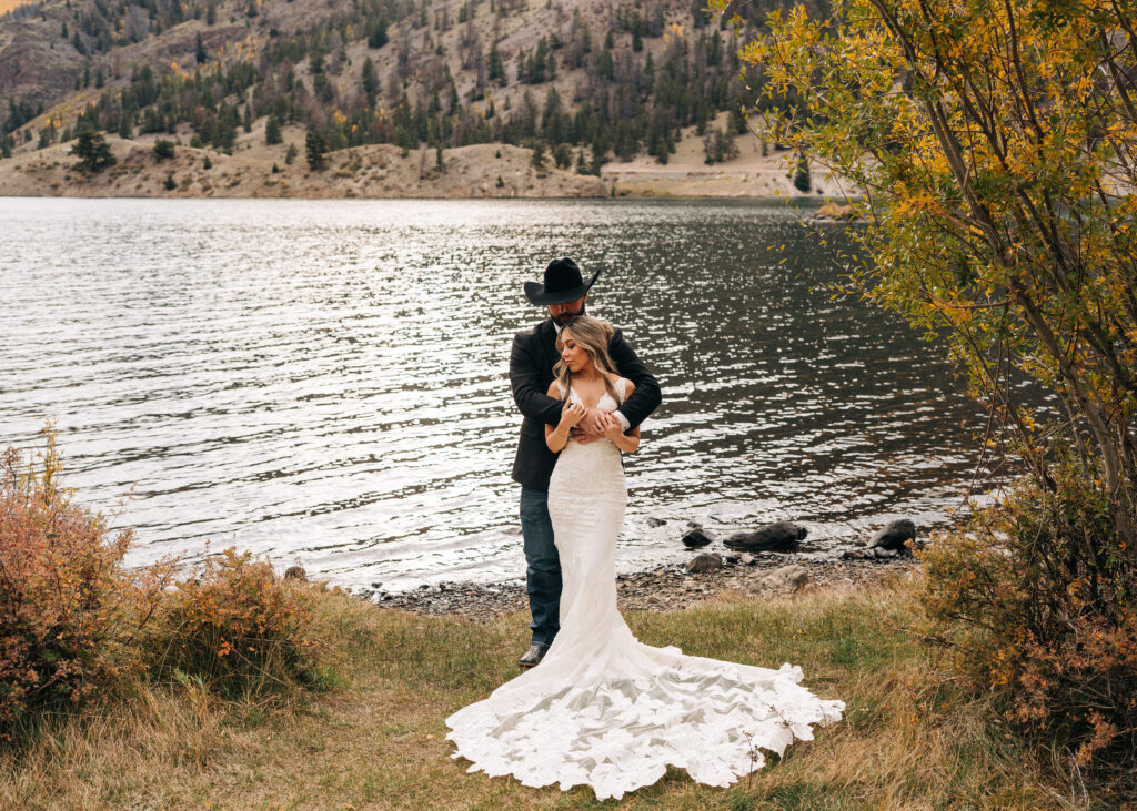 groom hugging bride from behind during their lake city colorado elopement