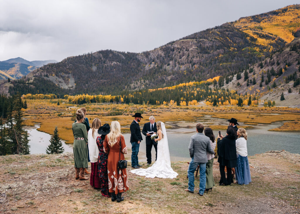 bride and groom's ceremony on a cliff in lake city colorado