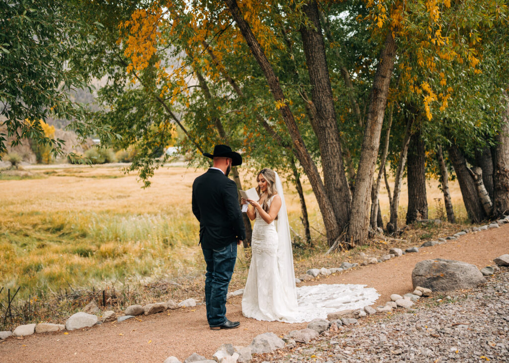 bride reading her vows to groom during their lake city colorado elopement