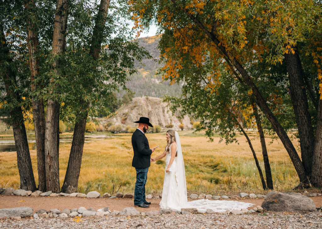 Groom reading vows to bride during their first look at their lake city colorado elopement