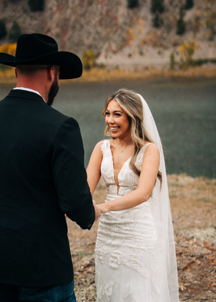 bride smiling and laughing at groom during their lake city colorado elopement