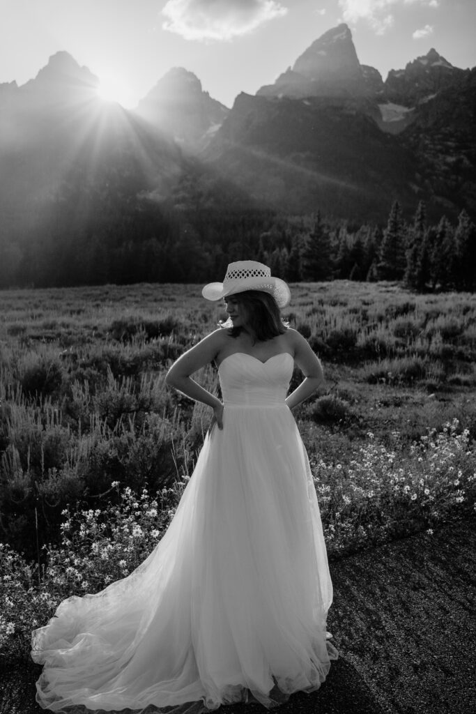 bride standing in a meadow in grand teton national park