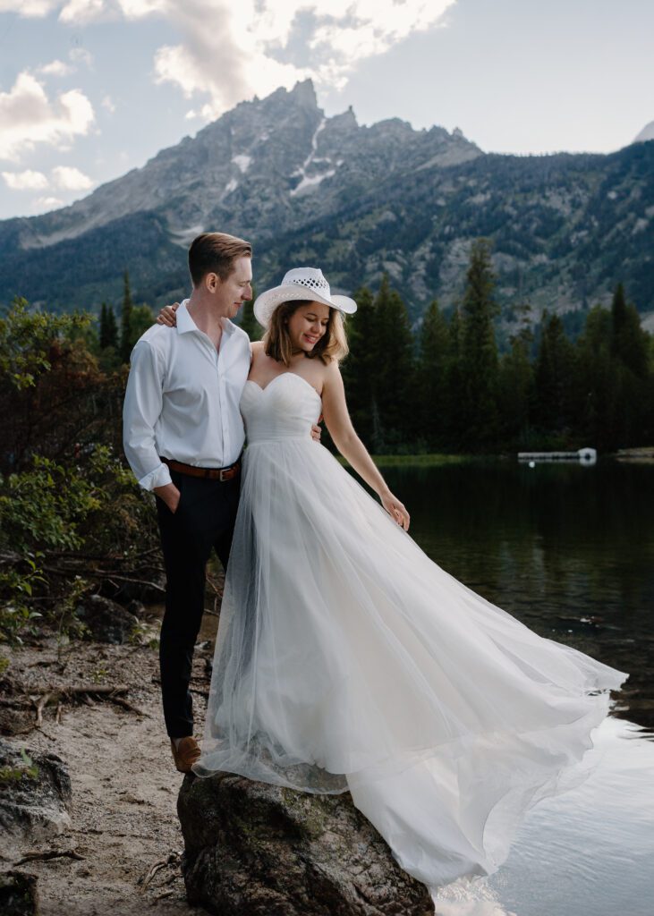 bride and groom at lake jenny in grand teton national park during their elopement photos