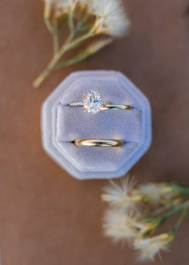 detail shot of bride and grooms ring in a velvet ring box during their colorado springs elopement