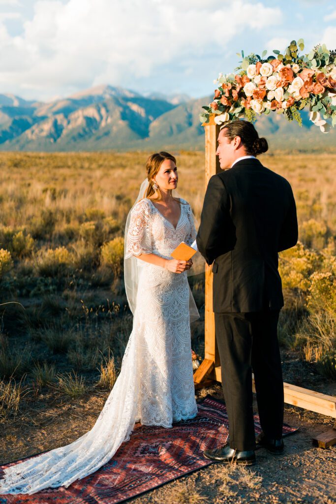 bride reading vows to groom during their colorado springs elopement