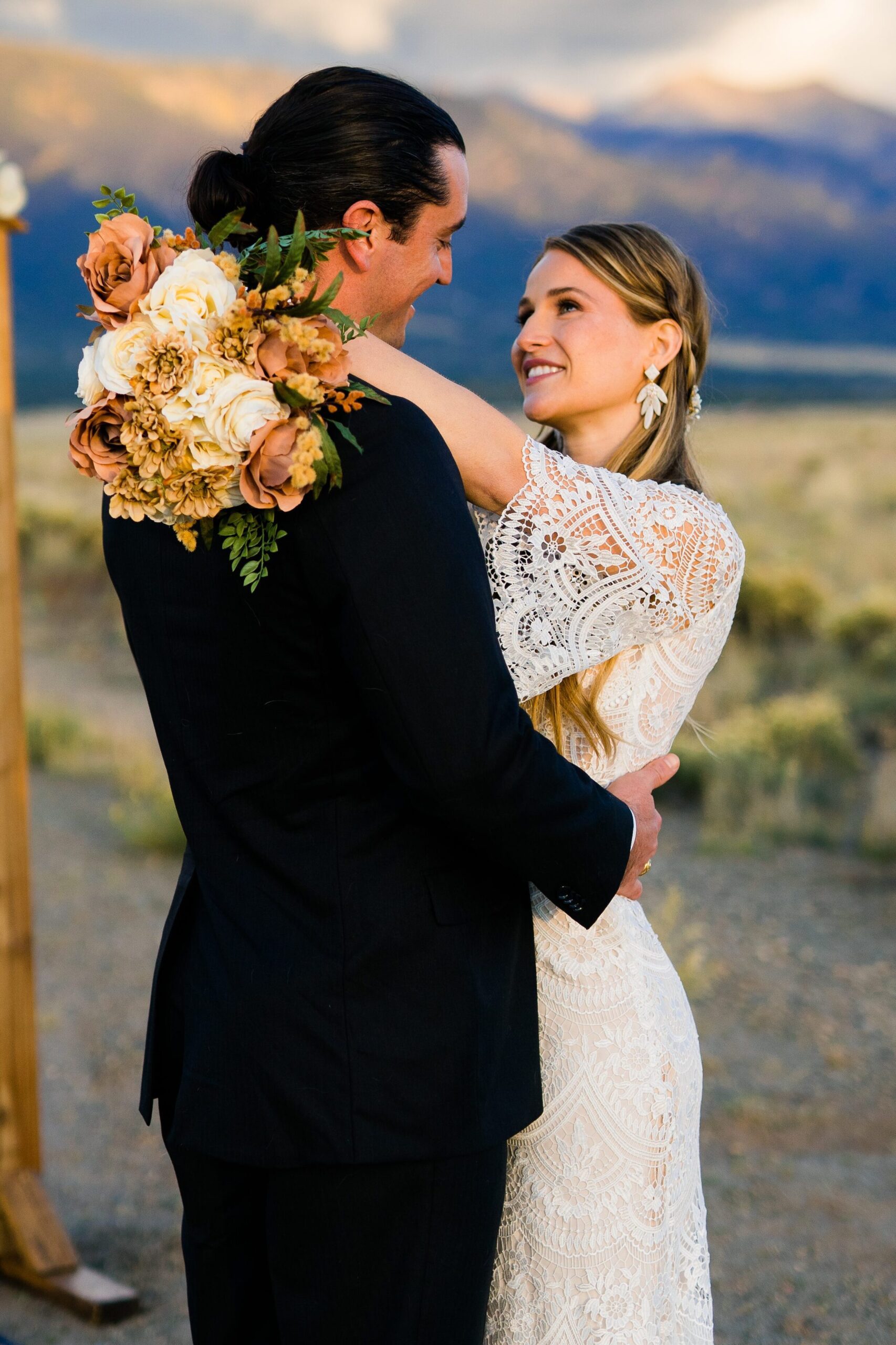 bride and groom smiling at each other during golden hour during their colorado springs elopement