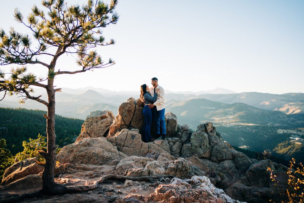 couples standing on some rocks at lost gulch overlook in boulder colorado during their couples photoshootc