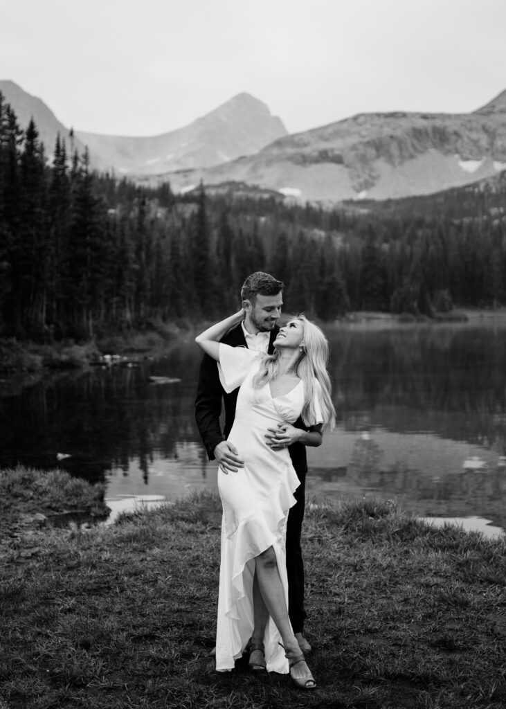 black and white image of bride and groom at Lake Mitchell in Brainard Lake Recreation Area during their elopement photoshoot in Colorado

