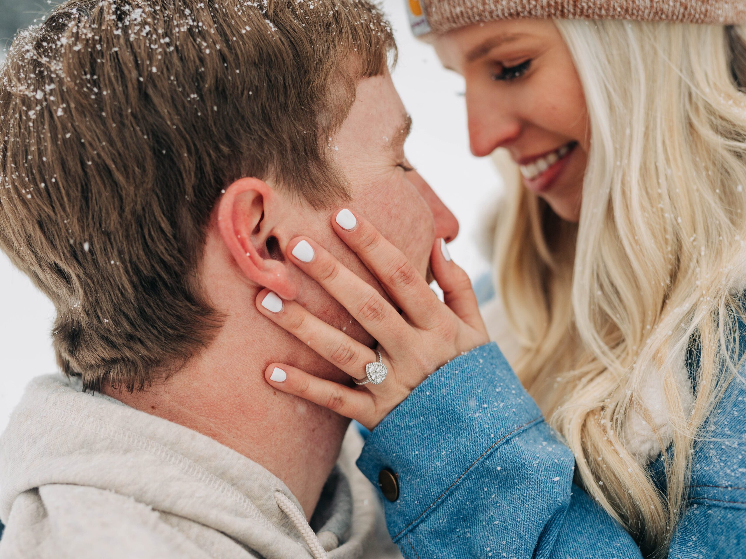 closeup of brides engagement ring during their snowy breckenridge engagement session