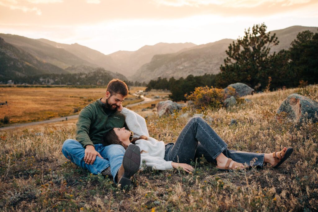 Kadi laying in Corwin's lap after he just proposed to her at sunset at rocky mountain national park