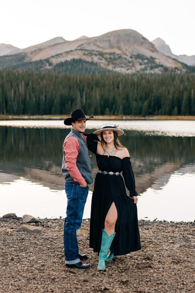 Engaged couple dancing on the shoreline at Brainard Lake Recreation Area during their engagement session