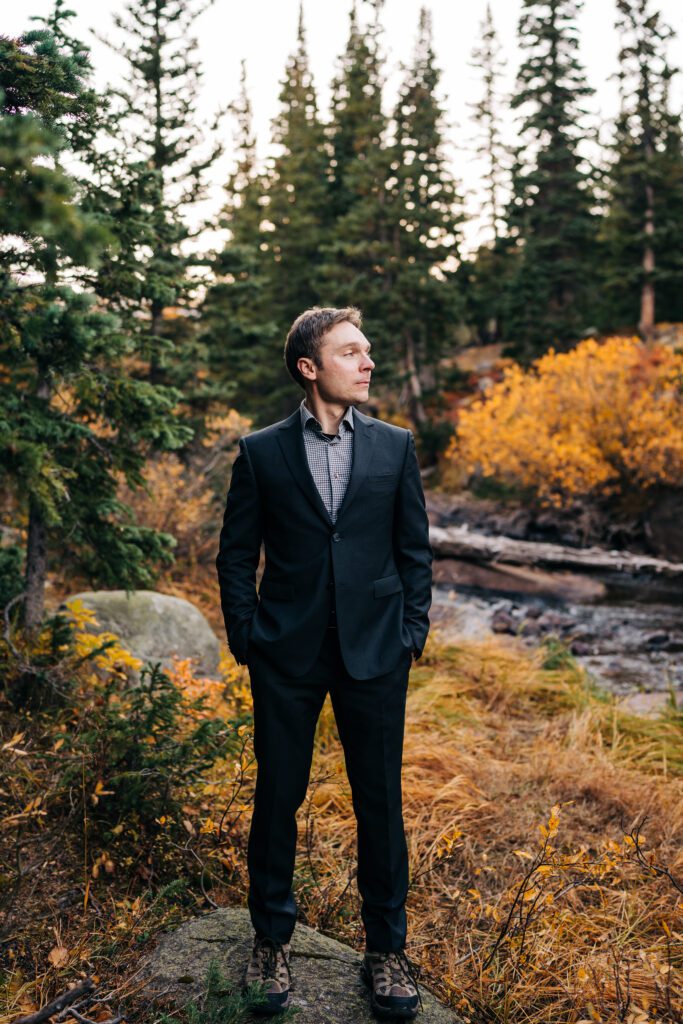 groom looking off in the distance during his brainard lake elopement