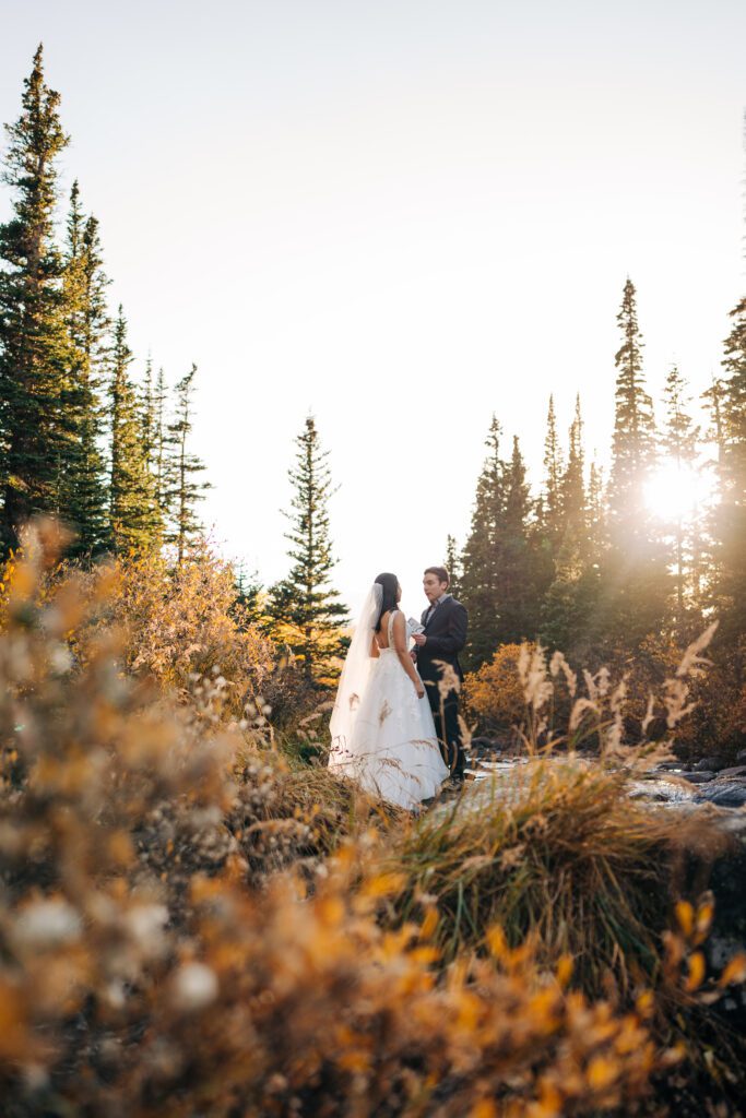 groom reading his wedding vows to his bride during their brainard lake elopement near boulder, colorado.