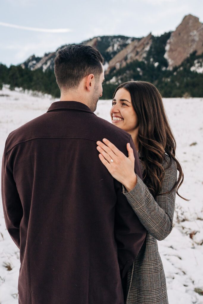 Girlfriend smiling at her boyfriend after he just proposed her at Chautauqua Park in Boulder, Colorado during their winter engagement session.