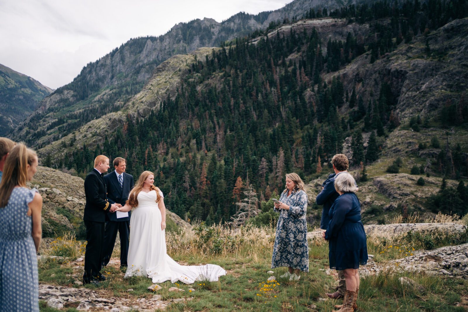 bride listening to her sister talking at her ceremony during her ouray elopement in colorado