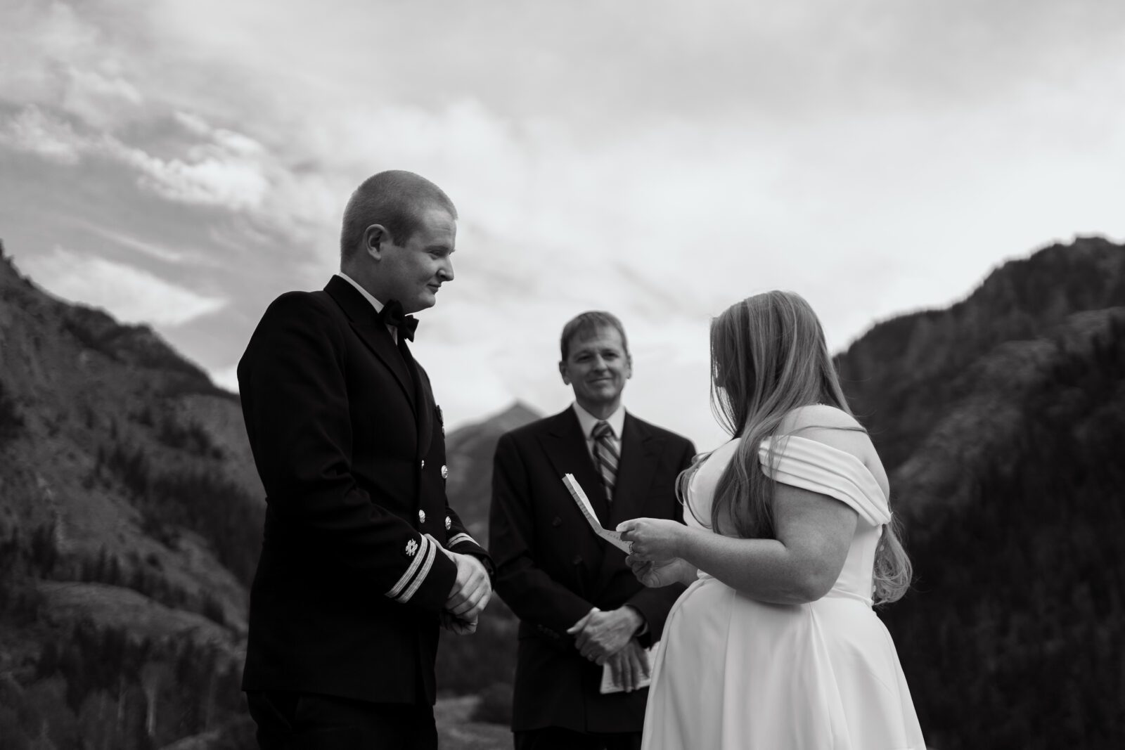 black and white image of bride reading her vows to the groom during their ouray elopement in colorado