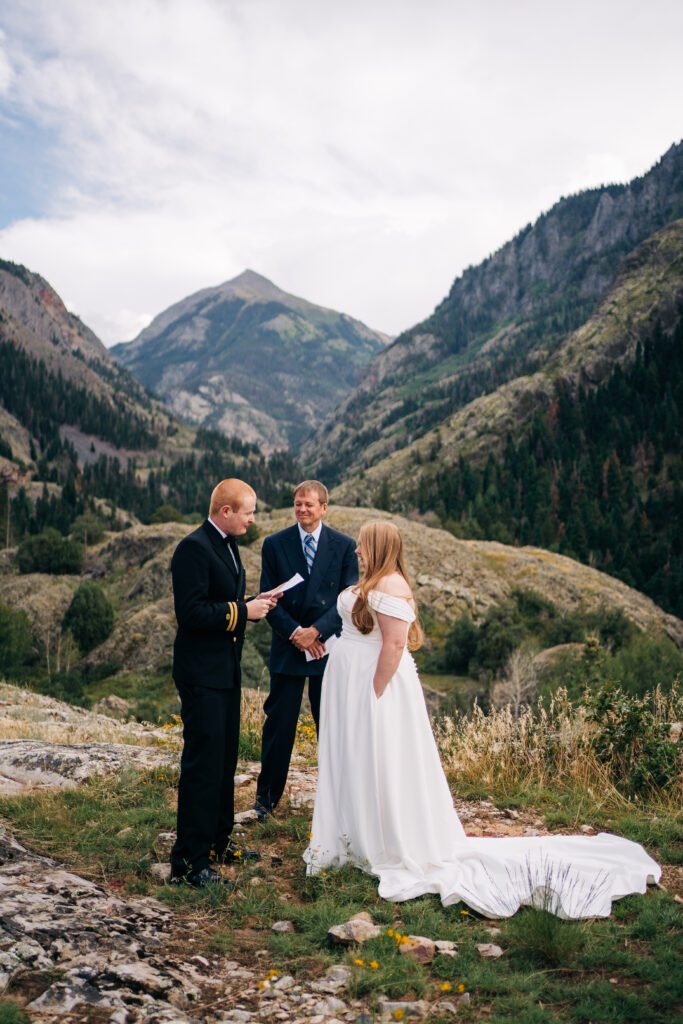 groom reading his vows to his bride during their ouray elopement in colorado 