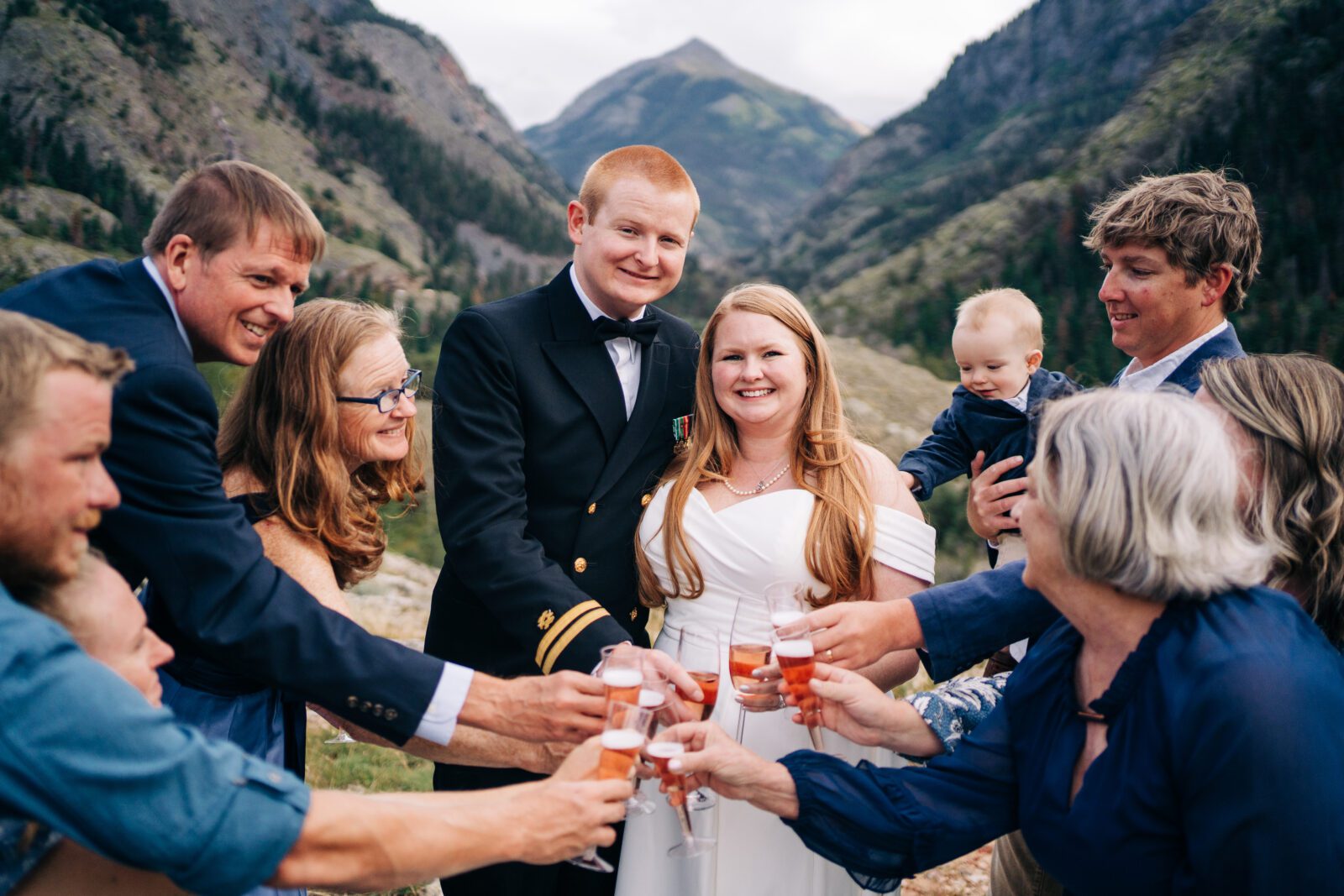 bride and groom toasting champagne with their friends and family during their ouray elopement in colorado 