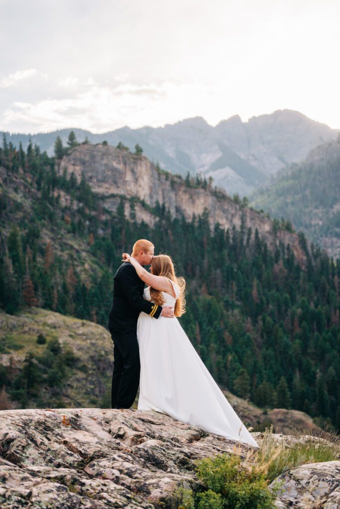 Groom kissing brides forehead during their ouray elopement in colorado