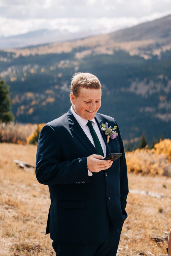 Groom reading his vows during their Breckenridge elopement