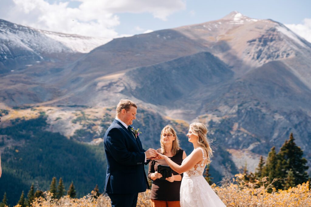 Bride and groom holding hands during their Breckenridge elopement