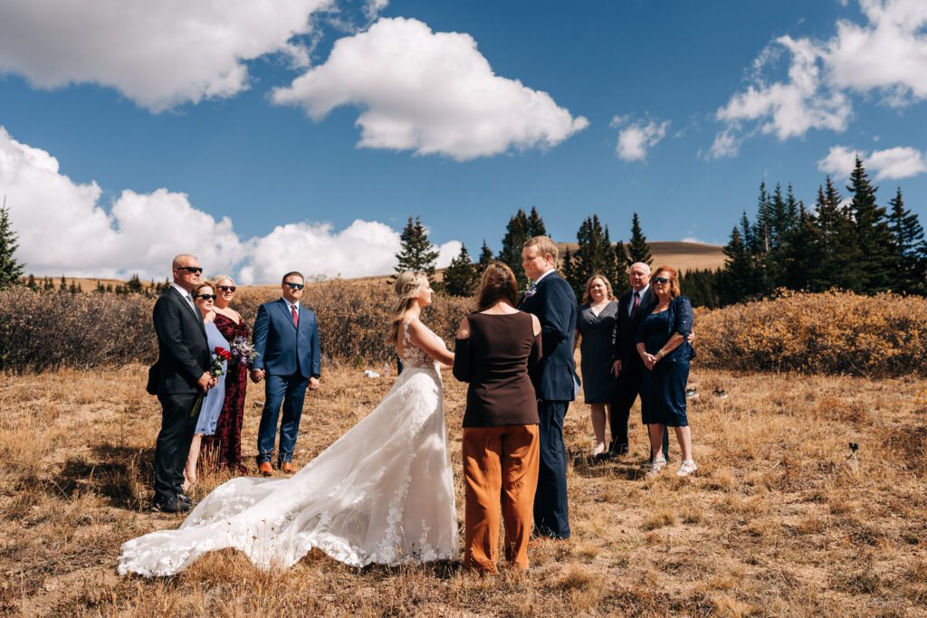 Bride and groom holding hands during their Breckenridge elopement