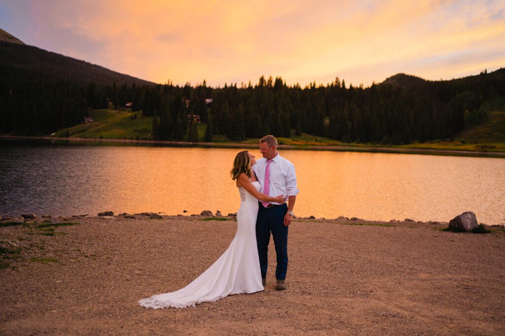 Bride and Groom holding eachother during sunset as their Telluride elopement comes to a close