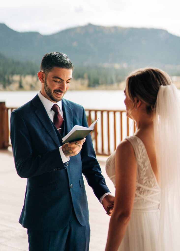 Groom reading his vows during their rocky mountain national park elopement
