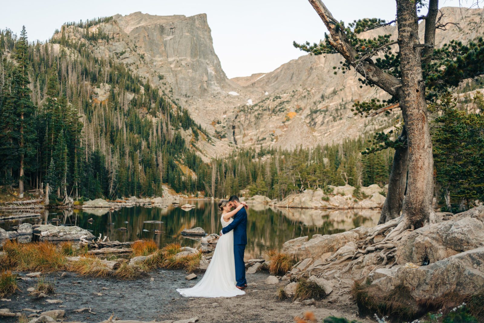 Bride and groom forehead to forehead soaking in the moment after their rocky mountain national park elopement ceremony