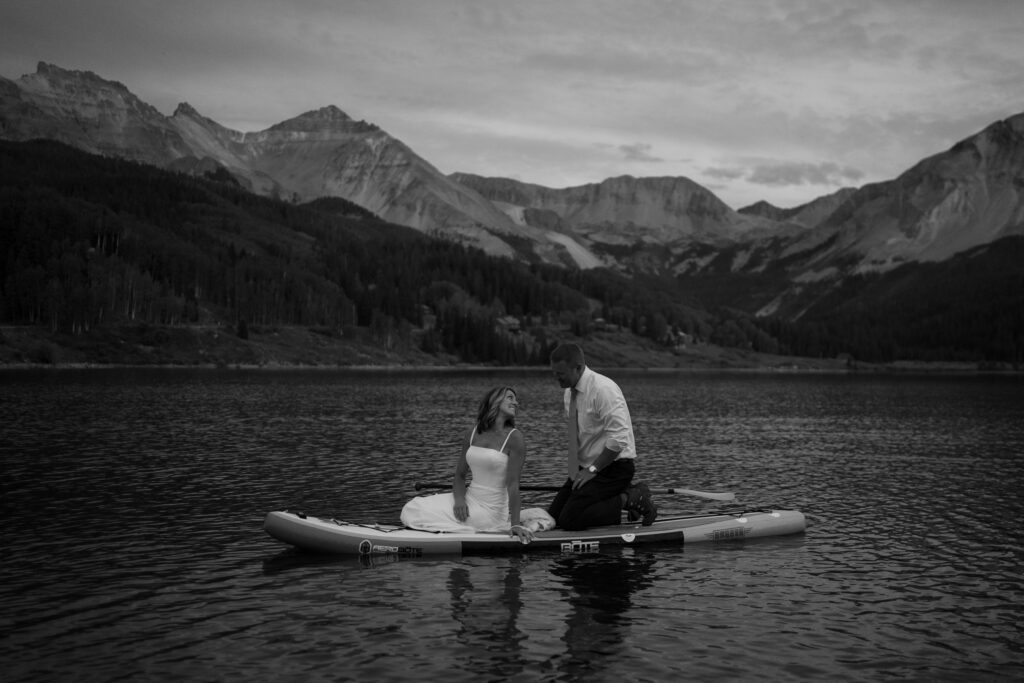 Bride and groom paddleboarding on Trout lake during their Telluride elopement